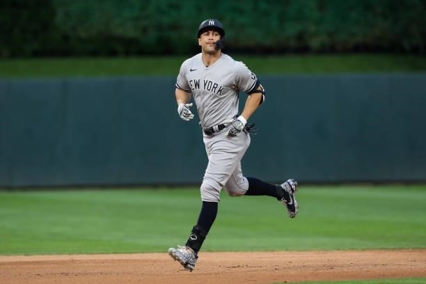 Giancarlo Stanton of the New York Yankees rounds the bases after hitting a two-run home run against the Minnesota Twins in the fifth inning of the...