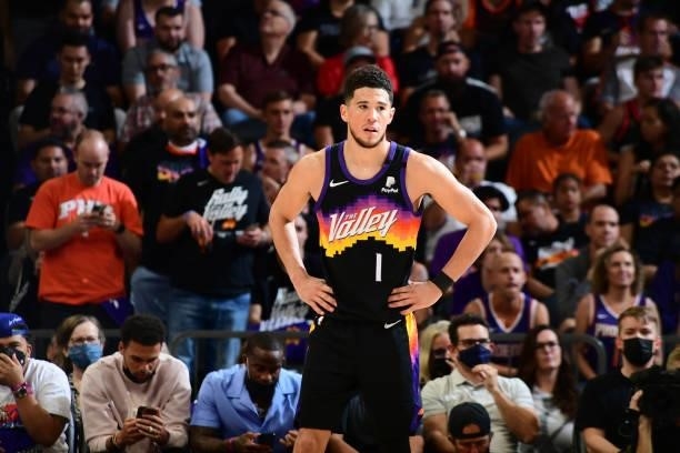 Devin Booker of the Phoenix Suns looks on against the Denver Nuggets during Round 2, Game 2 of the 2021 NBA Playoffs on June 9, 2021 at Phoenix Suns...