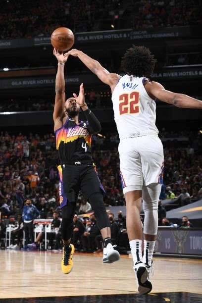 Jevon Carter of the Phoenix Suns shoots the ball against the Denver Nuggets during Round 2, Game 2 of the NBA Playoffs on June 9, 2021 at Phoenix...