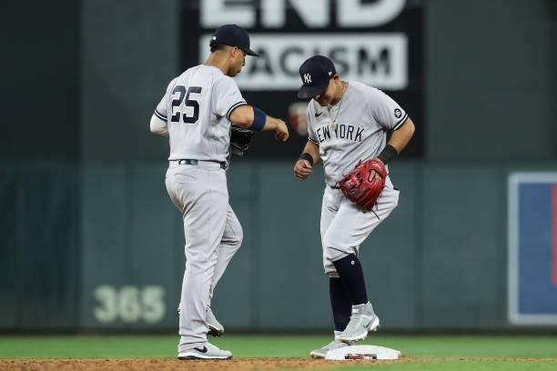 Gleyber Torres and Rougned Odor of the New York Yankees celebrate their victory against the Minnesota Twins at Target Field on June 9, 2021 in...