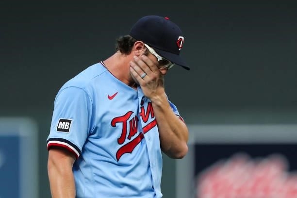 Randy Dobnak walks to the dugout after being removed from the game by Rocco Baldelli of the Minnesota Twins in the fifth inning of the game against...