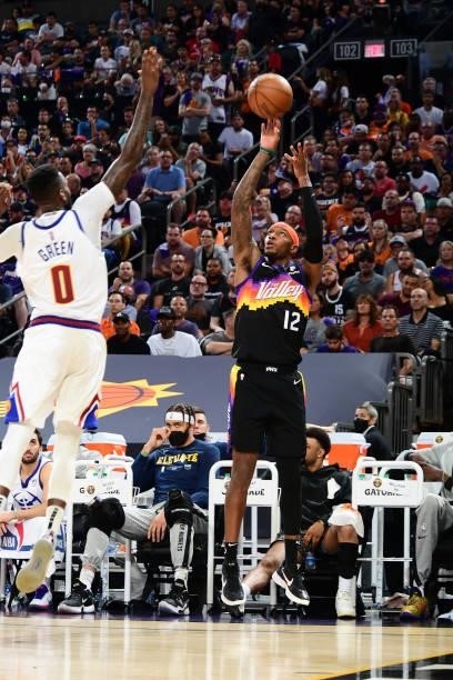 Torrey Craig of the Phoenix Suns shoots a three point basket against the Denver Nuggets during Round 2, Game 2 of the 2021 NBA Playoffs on June 9,...