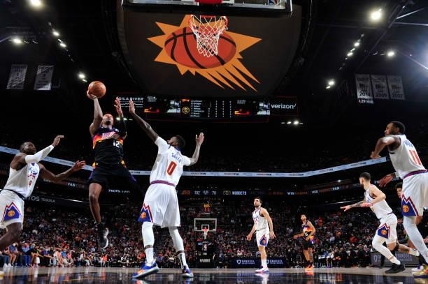 Torrey Craig of the Phoenix Suns shoots the ball against the Denver Nuggets during Round 2, Game 2 of the 2021 NBA Playoffs on June 9, 2021 at...