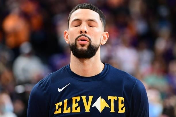 Austin Rivers of the Denver Nuggets looks on before the game against the Phoenix Suns during Round 2, Game 2 of the 2021 NBA Playoffs on June 9, 2021...