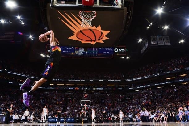 Devin Booker of the Phoenix Suns dunks the ball against the Denver Nuggets during Round 2, Game 2 of the 2021 NBA Playoffs on June 9, 2021 at Phoenix...
