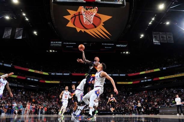 Torrey Craig of the Phoenix Suns shoots the ball against the Denver Nuggets during Round 2, Game 2 of the 2021 NBA Playoffs on June 9, 2021 at...
