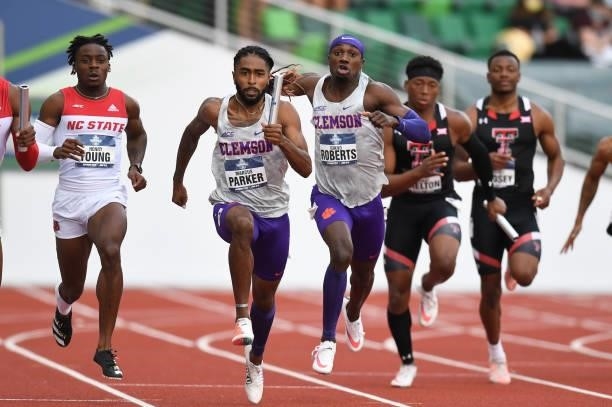 Giano Roberts and Markus Parker of the Clemson University Tigers compete in the 4 x 100 meter relay during the Division I Men's and Women's Outdoor...