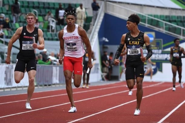 Terrance Laird of the LSU Tigers glances at Shaun Maswanganyi of the Houston Cougars in the 4x100 meter relay during the Division I Men's and Women's...