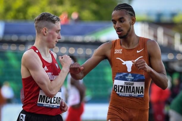 Yusuf Bizimana of the Texas Longhorns and Finley McLear of the Miami RedHawks fist bump after the 800 meter run during the Division I Men's and...