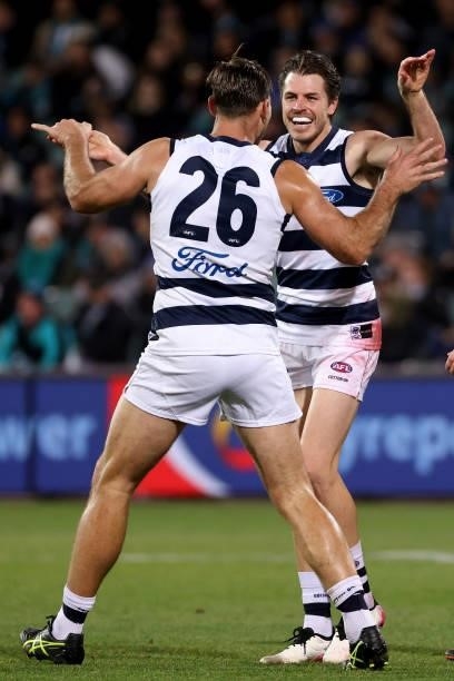 Tom Hawkins and Isaac Smith of the Cats celebrate a goal during the 2021 AFL Round 13 match between the Port Adelaide Power and the Geelong Cats at...