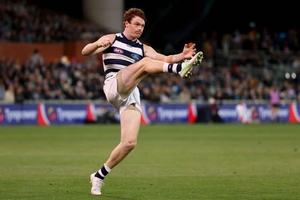 Gary Rohan of the Cats kicks the ball during the 2021 AFL Round 13 match between the Port Adelaide Power and the Geelong Cats at Adelaide Oval on...