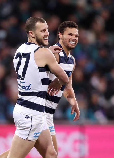 Brandan Parfitt of the Cats celebrates a goal with Sam Menegola during the 2021 AFL Round 13 match between the Port Adelaide Power and the Geelong...