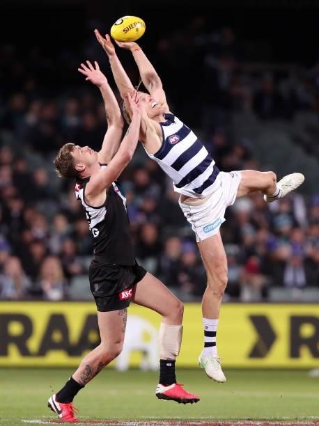Peter Ladhams of the Power and Mark Blicavs of the Cats during the 2021 AFL Round 13 match between the Port Adelaide Power and the Geelong Cats at...