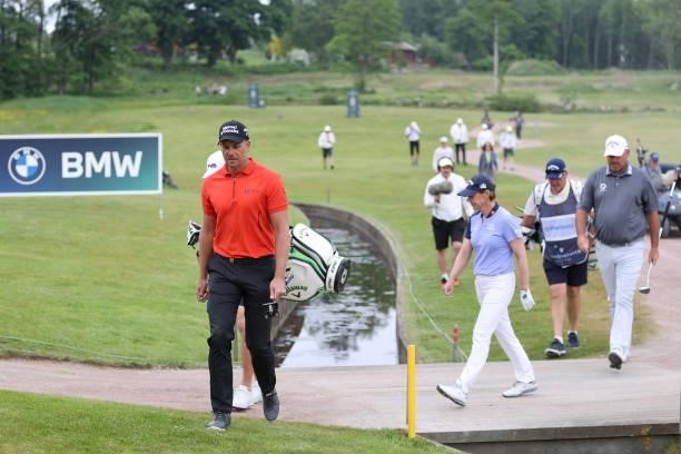Annika Sorenstam of Sweden,Thomas Bjorn of Denmark and Henrik Stenson of Sweden walk together on the 8th hole during the first round of The...