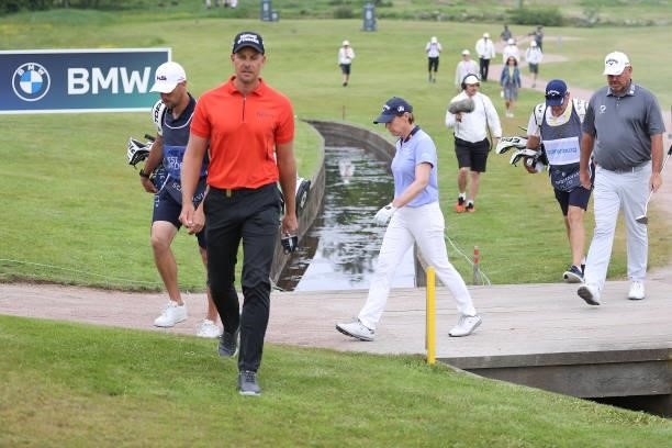 Annika Sorenstam of Sweden,Thomas Bjorn of Denmark and Henrik Stenson of Sweden walk together on the 8th hole during the first round of The...