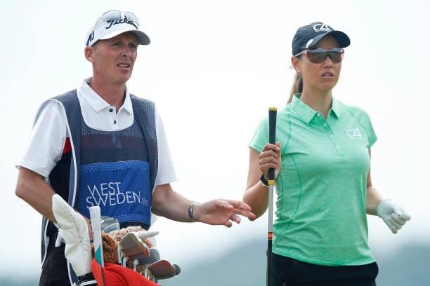 Whitney Hillier of Australia looks on with caddie Mike Dean on the 4th hole during the first round of The Scandinavian Mixed Hosted by Henrik and...