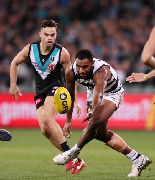 Esava Ratugolea of the Cats with Karl Amon of the Power in the background during the 2021 AFL Round 13 match between the Port Adelaide Power and the...