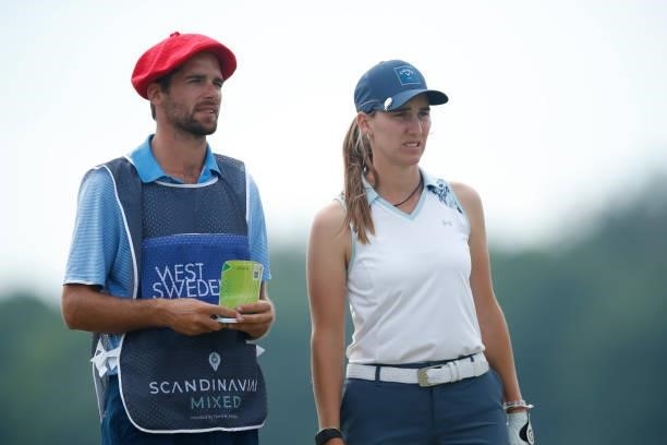 Magdalena Simmermacher of Argentina looks on with caddie on the 4th hole during the first round of The Scandinavian Mixed Hosted by Henrik and Annika...