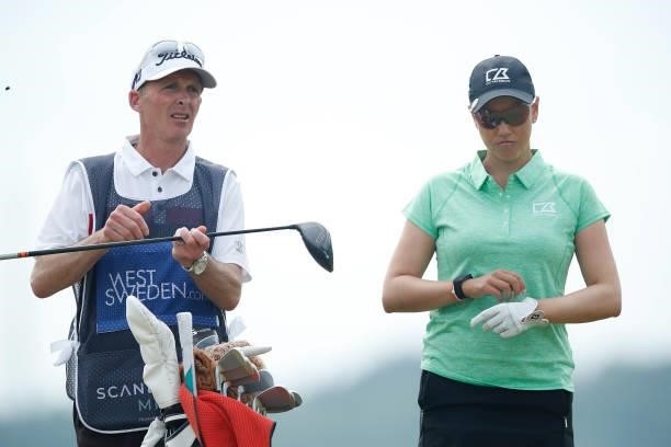 Whitney Hillier of Australia looks on with caddie Mike Dean on the 4th hole during the first round of The Scandinavian Mixed Hosted by Henrik and...