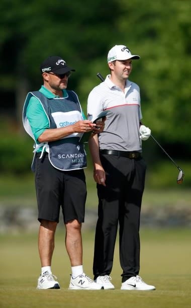 Ashley Chesters of England looks down the 6th hole with caddie during the first round of The Scandinavian Mixed Hosted by Henrik and Annika at Vallda...