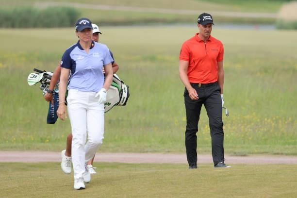 Annika Sorenstam of Sweden and Henrik Stenson of Sweden walk on the 11th hole during the first round of The Scandinavian Mixed Hosted by Henrik and...