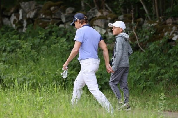 Annika Sorenstam of Sweden walks with her son William McGee during the first round of The Scandinavian Mixed Hosted by Henrik and Annika at Vallda...