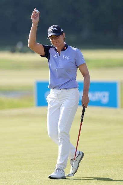 Annika Sorenstam of Sweden acknowledges the crowd on the 18th green during the first round of The Scandinavian Mixed Hosted by Henrik and Annika at...