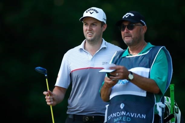Ashley Chesters of England looks down the 9th hole with caddie during the first round of The Scandinavian Mixed Hosted by Henrik and Annika at Vallda...