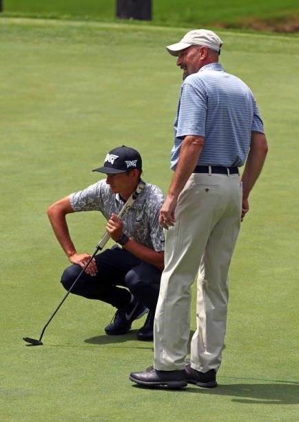 Garett Reband and Vincent Cialdella line up a putt on the 12th hole during the first round of the BMW Charity Pro-Am presented by Synnex Corporation...