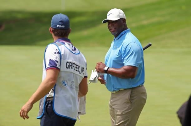 Ken Griffey, Jr. Speaks with his caddie on the 12th hole during the first round of the BMW Charity Pro-Am presented by Synnex Corporation at the...