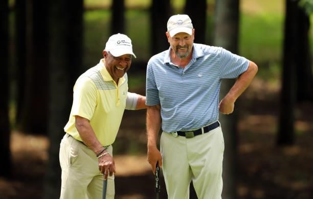 Ozzie Smith and Vincent Cialdella share a laugh on the 12th green during the first round of the BMW Charity Pro-Am presented by Synnex Corporation at...