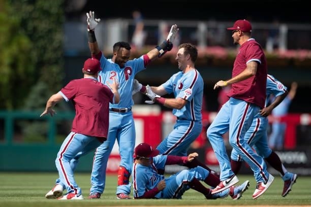 Jean Segura of the Philadelphia Phillies celebrates with hist teammates after hitting a walk-off two RBI single in the bottom of the tenth inning...