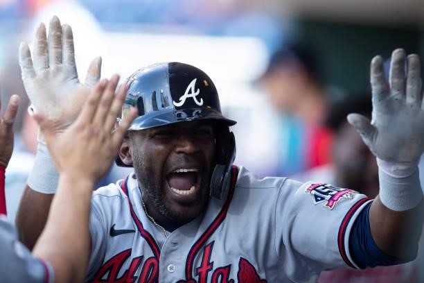 Guillermo Heredia of the Atlanta Braves reacts after scoring a run in the top of the tenth inning against the Philadelphia Phillies at Citizens Bank...