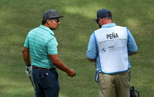 Michael Pena talks to his caddie on the fourth hole during the first round of the BMW Charity Pro-Am presented by Synnex Corporation at the...