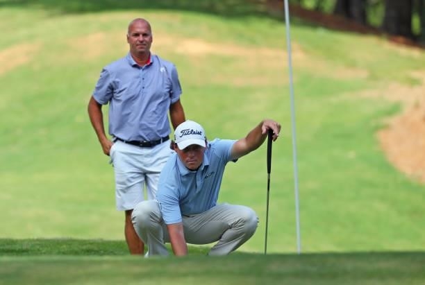 Michael Miller and playing partner Matt Minerva line up a putt on the fourth hole during the first round of the BMW Charity Pro-Am presented by...