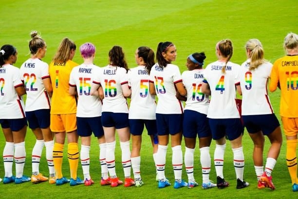 Members of the USWNT team pose showing their numbers in support for the LBGTQIA+ community prior to the the 2021 WNT Summer Series friendly against...