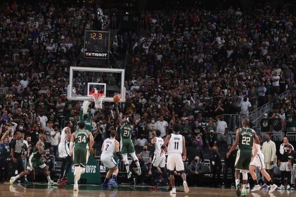 Jrue Holiday of the Milwaukee Bucks shoots the ball to take the lead against Brooklyn Nets during Round 2, Game 3 of the 2021 NBA Playoffs on June...