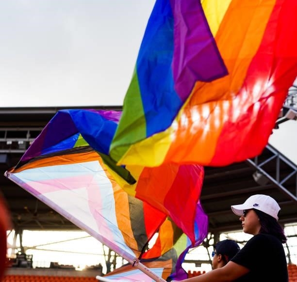 Fans wave flags representing support for the LBGTQIA+ community before the 2021 WNT Summer Series friendly between Portugal and the United States at...