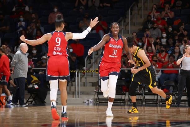 Natasha Cloud and Tina Charles of the Washington Mystics high five during the game against the Los Angeles Sparks on June 10, 2021 at Entertainment &...