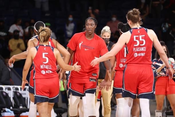 Tina Charles of the Washington Mystics high fives her teammates after the game against the Los Angeles Sparks on June 10, 2021 at Entertainment &...