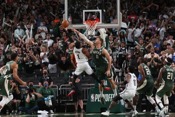 Brook Lopez of the Milwaukee Bucks plays defense during the game against Bruce Brown of the Brooklyn Nets during Round 2, Game 3 of the 2021 NBA...