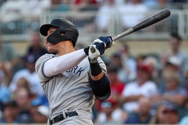 Aaron Judge of the New York Yankees hits a single against the Minnesota Twins in the first inning of the game at Target Field on June 10, 2021 in...
