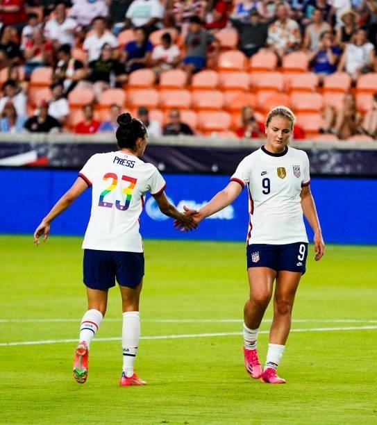 Christen Press of the United States high fives Lindsey Horan of the United States during the first half of the 2021 WNT Summer Series friendly...