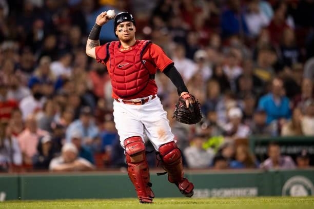 Christian Vazquez of the Boston Red Sox throws to first base to begin a double play during the seventh inning of a game against the Houston Astros on...