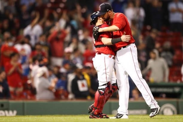 Matt Barnes embraces Christian Vazquez of the Boston Red Sox after a win over the Houston Astros at Fenway Park on June 10, 2021 in Boston,...