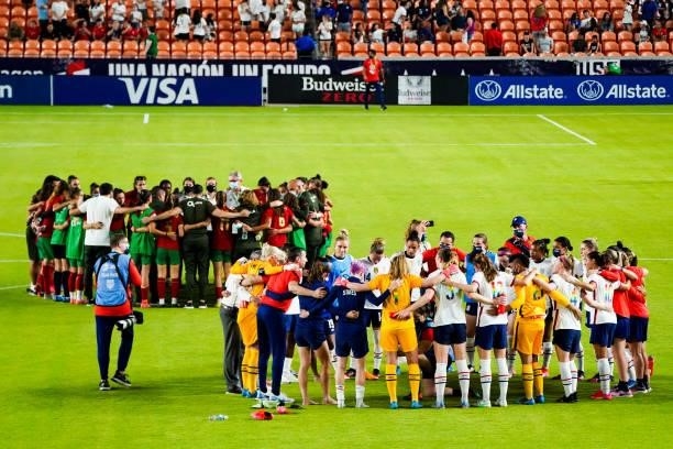 The United States and Portugal teams huddle at the conclusion of the 2021 WNT Summer Series friendly at BBVA Stadium on June 10, 2021 in Houston,...