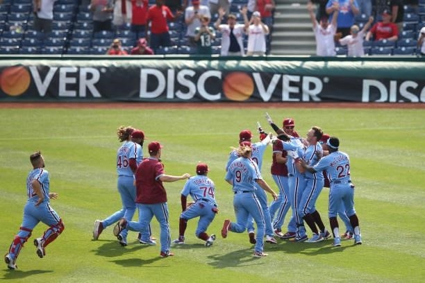 The Philadelphia Phillies celebrate a walk-off win after the game between the Atlanta Braves and the Philadelphia Phillies at Citizens Bank Park on...
