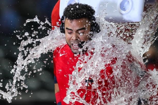 Nelson Cruz of the Minnesota Twins is doused with water after hitting a two-run walk off home run against the New York Yankees at Target Field on...