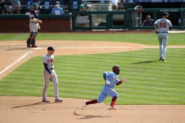 Odúbel Herrera of the Philadelphia Phillies runs to second on a double during the game between the Atlanta Braves and the Philadelphia Phillies at...