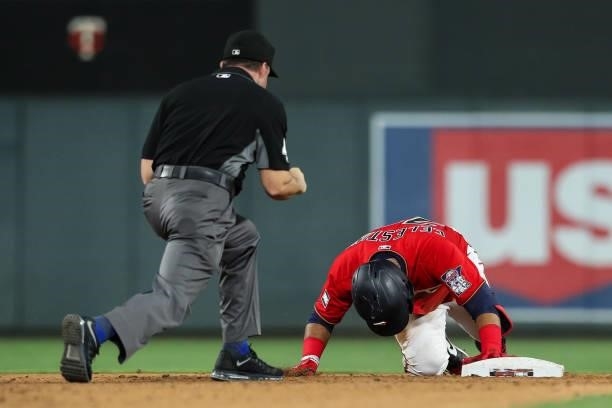 Gilberto Celestino of the Minnesota Twins reacts to being called out by umpire Nick Mahrley at second base in the eighth inning of the game against...